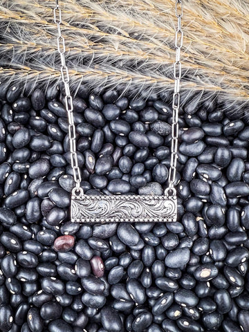 bar necklace on beans and wheat