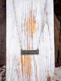 bar necklace on wood