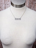 bar necklace on mannequin 