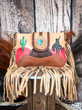 bag on wood table, feathers and wheat in background, wood backdrop
