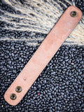 back of bracelet on beans and wheat