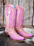 boots on cowhide, wood backdrop