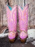 back of boots on cow hide, wood backdrop