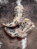 Boots displayed on cowhide.