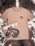 Front and back design of the Rattler Hooey T-Shirt displayed on cowhide.