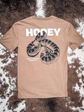 Back view of the Rattler Hooey T-Shirt on cow hide.
