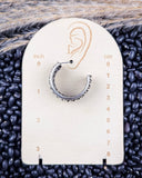 Twist and Timber Fashion Hoop Earrings displayed on ruler, sitting on beans and wheat.