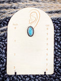 Prairie Petals Stud Fashion Earring on a ruler, displayed on beans and wheat.