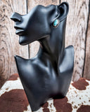 Prairie Petals Stud Fashion Earring on a mannequin, sitting on cowhide, wood backdrop.