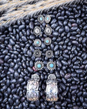 Sky and Stone Stud Fashion Earring Set displayed on beans and wheat.