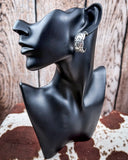 Sky and Stone Stud Fashion Earring Set on a mannequin, sitting on cowhide, wood back drop.