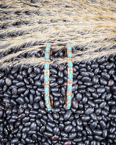 Texas Petal Fashion Hoop Earrings displayed on beans and wheat.