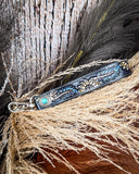 Cheyenne Bloom Hand-Tooled Key Fob displayed on wheat, wood back drop.