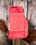 Side view of the Rio Vintage Clothing Weekender Bag on a wood table with a wood back drop.