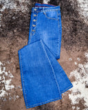 The Saloon Stretch Five Button Flare Jeans displayed on cowhide.