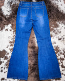 Back view of the Saloon Stretch Five Button Flare Jeans displayed on cowhide.