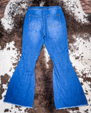 Back view of the Shannon Flare Jeans displayed on cowhide.