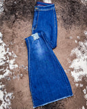 The Shannon Flare Jeans displayed on cowhide.