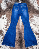 Back view of the Shannon Flare Jeans displayed on cowhide.