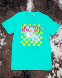 Front view of the Buckin Babe Howdy Graphic Tee displayed on cowhide. 