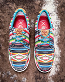 The Paloma Pop Twisted X Hooey Loper displayed on cowhide.