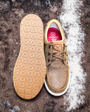 Front and bottom of the Goldenroot Twisted X Kicks displayed on cowhide.