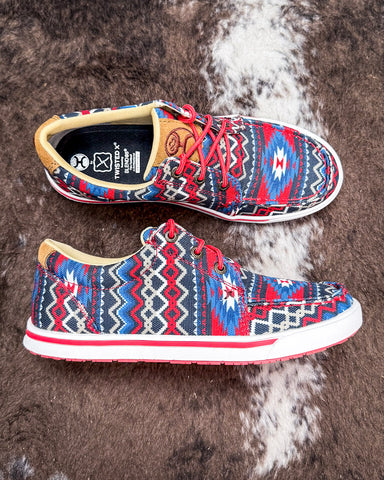 The Liberty Loop Twisted X Hooey Loper displayed on cowhide.