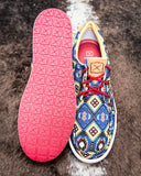 Top and bottom of the Remmy Twisted X Kicks Sneaker displayed on cowhide.