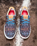 The Neon Mesa Twisted X Kicks displayed on cowhide.