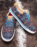 The Neon Mesa Twisted X Kicks displayed on cowhide.