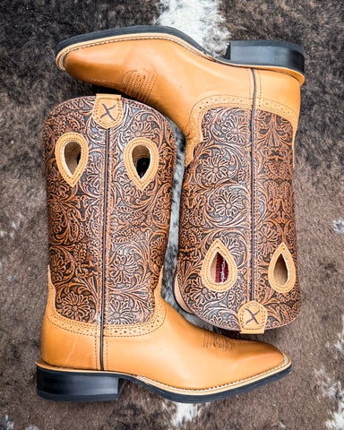 The Sienna Twisted X Women's 11" Ruff Stock Boot displayed on cowhide.