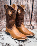 Side view of the Sienna Twisted X Women's 11" Ruff Stock Boot displayed on cowhide, wood backdrop.