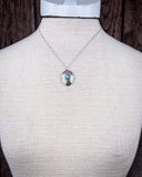 The Abeytu Genuine Turquoise Necklace shown on a mannequin,