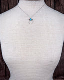 The Naja Genuine Turquoise Necklace shown on a mannequin.