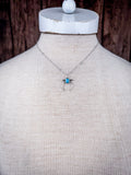 The Naja Genuine Turquoise Necklace shown on a manneqiun.