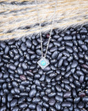 The Catalina Genuine Turquoise Necklace displayed on cowhide.