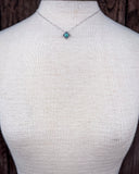 The Catalina Genuine Turquoise Necklace shown on a mannequin.