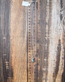 The Catalina Genuine Turquoise Necklace displayed on a ruler showing size, wood backdrop.