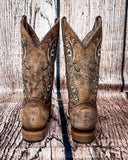 Back view of the Western Wildflower Circle G Boots in front of a wood backdrop.