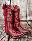 Side view of the Ironclad Rodeo Corral Boots in a wood backdrop.