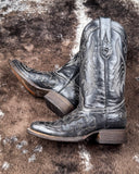The Midnight Slither Corral Boots displayed on cowhide.