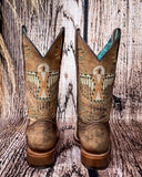 Back view of the Stormlash Corral Boots in a wood backdrop.