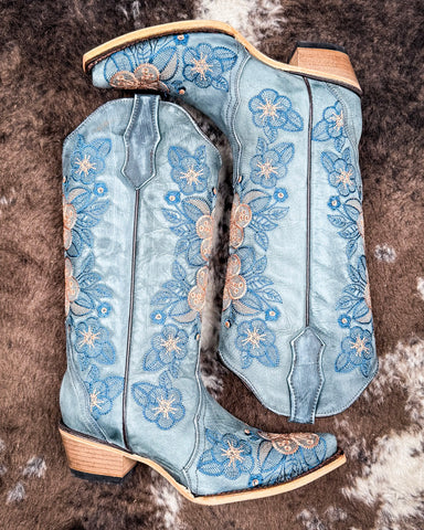 The Twilight Wrangler Circle G Boots displayed on cowhide.