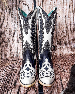 Front view of the Phantom Mesa Corral Boots in a wood backdrop.