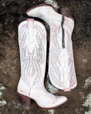 The Dust Rose Canyon Corral Boots displayed on cowhide.