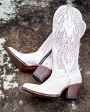 The Dust Rose Canyon Corral Boots displayed on cowhide.