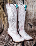 Side view of the Dust Rose Canyon Corral Boots with a wood backdrop.
