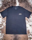 Front view of the Concho Hooey T-Shirt displayed on cowhide.