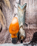 Front and bottom of the Skyward Spirit Corral Boots with a wood backdrop.