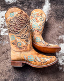 The Sandstone Stallion Corral Boots displayed on cowhide.